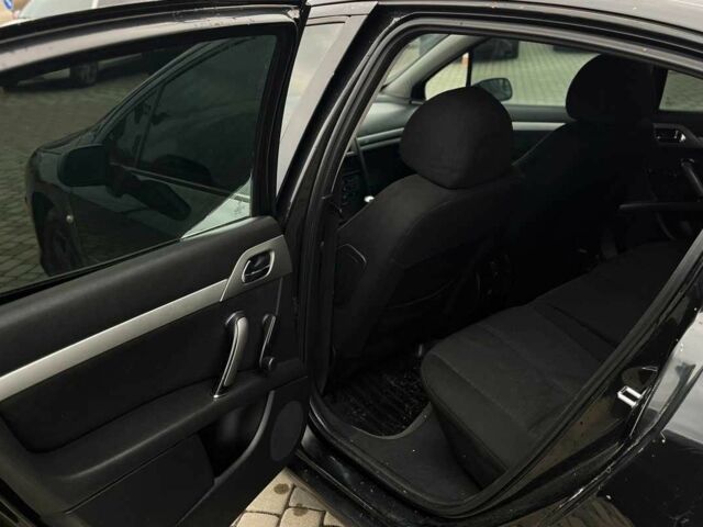 Черный Пежо 407, объемом двигателя 1.7 л и пробегом 238 тыс. км за 3700 $, фото 20 на Automoto.ua