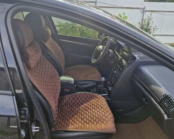 Черный Пежо 407, объемом двигателя 2.01 л и пробегом 290 тыс. км за 5300 $, фото 11 на Automoto.ua