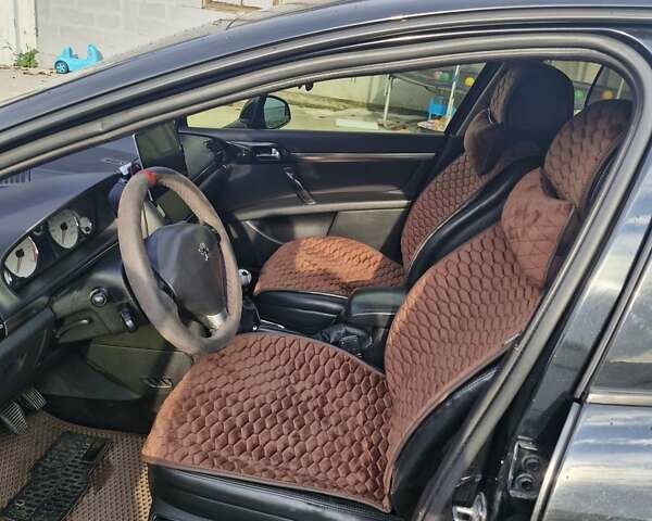 Черный Пежо 407, объемом двигателя 2.01 л и пробегом 290 тыс. км за 5300 $, фото 10 на Automoto.ua