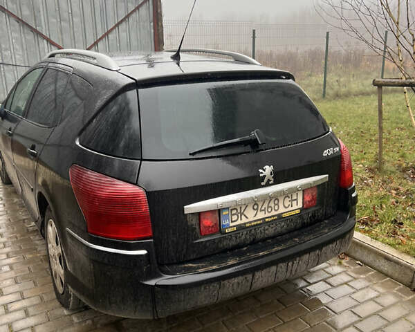 Черный Пежо 407, объемом двигателя 1.6 л и пробегом 330 тыс. км за 1700 $, фото 3 на Automoto.ua
