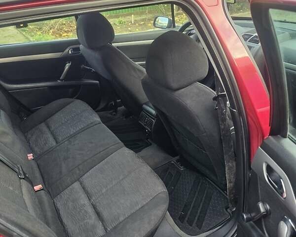 Красный Пежо 407, объемом двигателя 1.75 л и пробегом 303 тыс. км за 4500 $, фото 17 на Automoto.ua