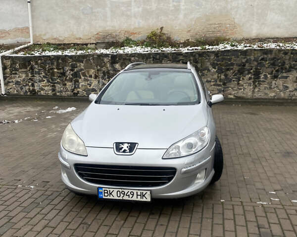 Серый Пежо 407, объемом двигателя 2 л и пробегом 301 тыс. км за 4700 $, фото 1 на Automoto.ua