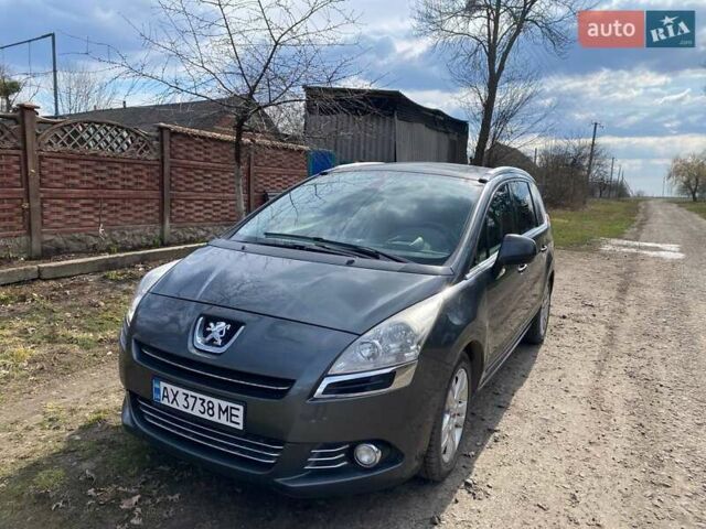 Серый Пежо 5008, объемом двигателя 1.6 л и пробегом 294 тыс. км за 7600 $, фото 1 на Automoto.ua
