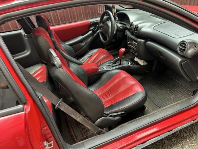 Красный Понтиак Санфаер, объемом двигателя 2.2 л и пробегом 200 тыс. км за 2800 $, фото 1 на Automoto.ua