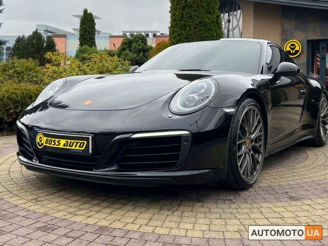 Черный Порше 911 Каррера, объемом двигателя 3 л и пробегом 55 тыс. км за 93900 $, фото 2 на Automoto.ua