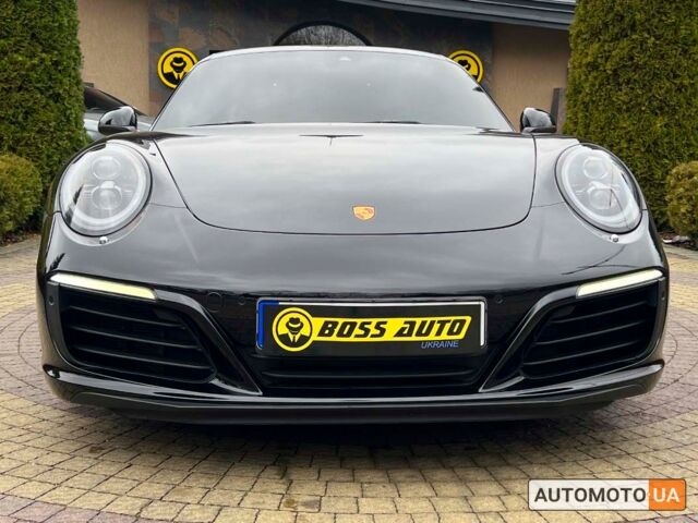 Черный Порше 911 Каррера, объемом двигателя 3 л и пробегом 55 тыс. км за 93900 $, фото 1 на Automoto.ua