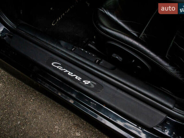 Черный Порше 911, объемом двигателя 3.6 л и пробегом 110 тыс. км за 41000 $, фото 42 на Automoto.ua