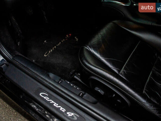 Черный Порше 911, объемом двигателя 3.6 л и пробегом 110 тыс. км за 41000 $, фото 45 на Automoto.ua