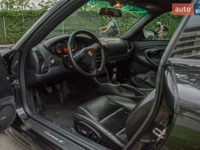 Черный Порше 911, объемом двигателя 3.6 л и пробегом 110 тыс. км за 41000 $, фото 39 на Automoto.ua