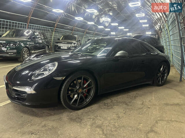 Черный Порше 911, объемом двигателя 3.8 л и пробегом 53 тыс. км за 82000 $, фото 1 на Automoto.ua