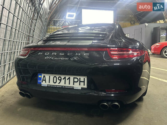 Черный Порше 911, объемом двигателя 3.8 л и пробегом 53 тыс. км за 82000 $, фото 4 на Automoto.ua