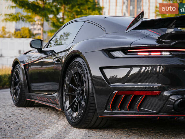 Черный Порше 911, объемом двигателя 3.75 л и пробегом 7 тыс. км за 410000 $, фото 6 на Automoto.ua