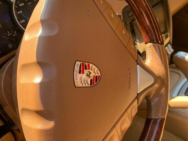 Черный Порше Каен, объемом двигателя 4.8 л и пробегом 150 тыс. км за 12500 $, фото 10 на Automoto.ua