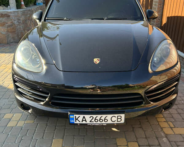 Черный Порше Каен, объемом двигателя 2.97 л и пробегом 250 тыс. км за 21500 $, фото 1 на Automoto.ua