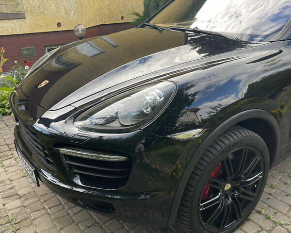 Черный Порше Каен, объемом двигателя 4.81 л и пробегом 136 тыс. км за 26000 $, фото 2 на Automoto.ua