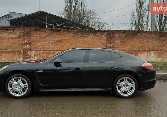 Черный Порше Панамера, объемом двигателя 4.81 л и пробегом 114 тыс. км за 29000 $, фото 1 на Automoto.ua