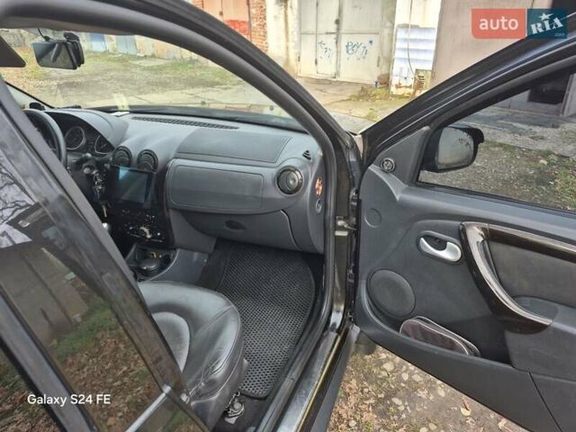 Черный Рено Дастер, объемом двигателя 1.6 л и пробегом 94 тыс. км за 8900 $, фото 2 на Automoto.ua