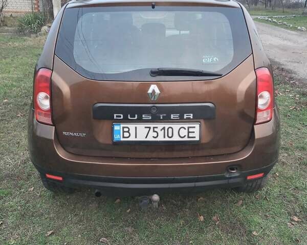 Коричневый Рено Дастер, объемом двигателя 1.6 л и пробегом 230 тыс. км за 7000 $, фото 2 на Automoto.ua