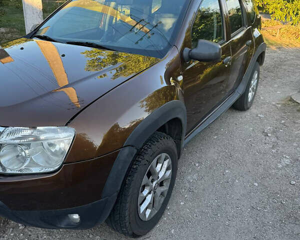 Коричневый Рено Дастер, объемом двигателя 2 л и пробегом 222 тыс. км за 8100 $, фото 1 на Automoto.ua