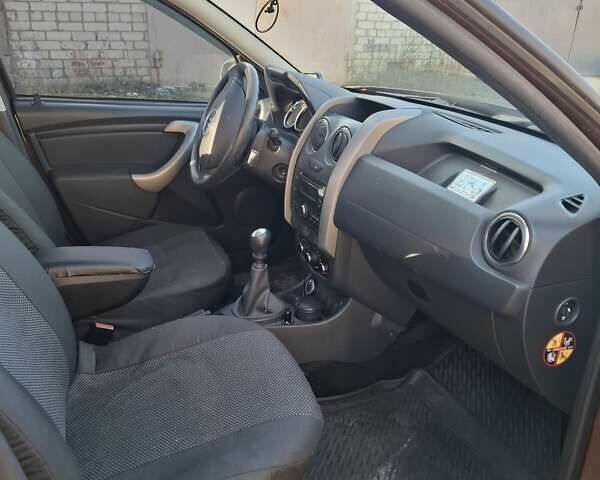 Коричневый Рено Дастер, объемом двигателя 1.45 л и пробегом 142 тыс. км за 10500 $, фото 5 на Automoto.ua