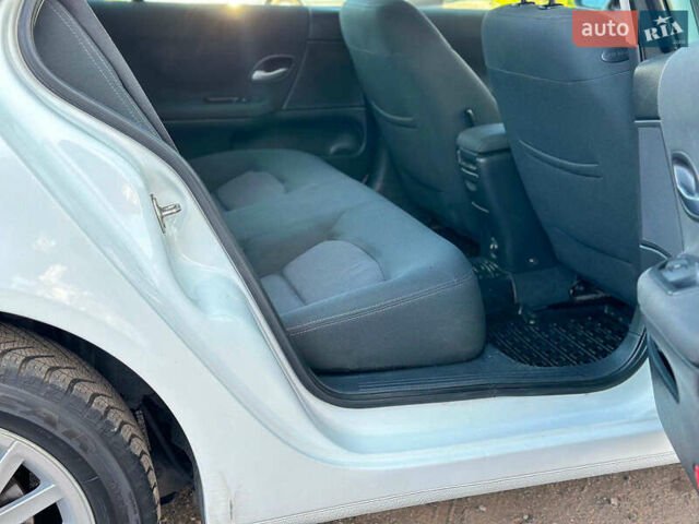 Белый Рено Лагуна, объемом двигателя 1.9 л и пробегом 231 тыс. км за 4990 $, фото 29 на Automoto.ua
