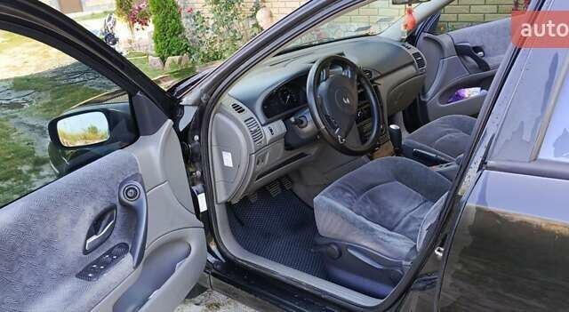 Черный Рено Лагуна, объемом двигателя 1.9 л и пробегом 320 тыс. км за 3100 $, фото 1 на Automoto.ua