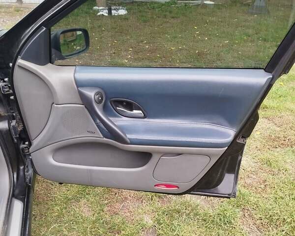 Черный Рено Лагуна, объемом двигателя 2.2 л и пробегом 287 тыс. км за 3950 $, фото 2 на Automoto.ua