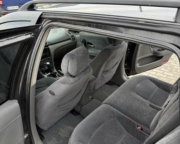 Черный Рено Лагуна, объемом двигателя 1.87 л и пробегом 325 тыс. км за 3599 $, фото 6 на Automoto.ua