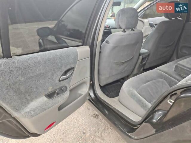Черный Рено Лагуна, объемом двигателя 1.78 л и пробегом 375 тыс. км за 2950 $, фото 24 на Automoto.ua