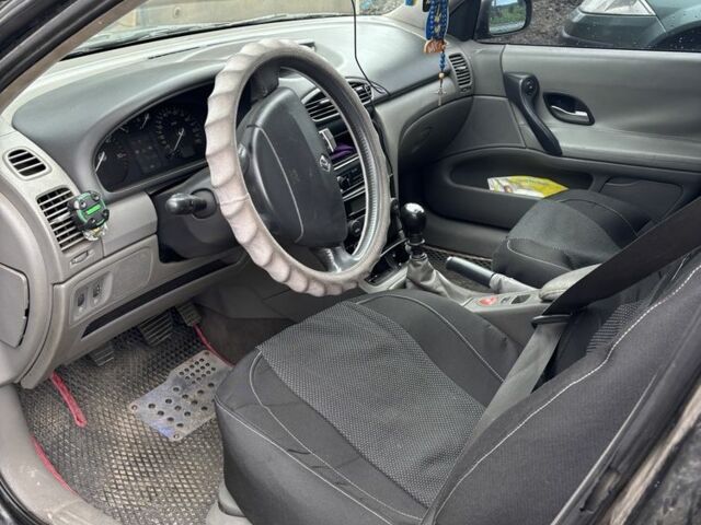 Черный Рено Лагуна, объемом двигателя 1.9 л и пробегом 350 тыс. км за 4000 $, фото 4 на Automoto.ua