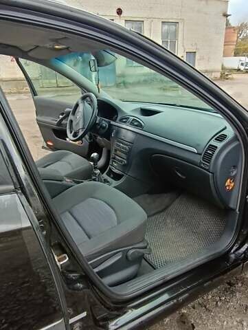 Рено Лагуна 2006 в Луцке на Automoto.ua Черный Рено Лагуна, объемом двигателя 1.9 л и пробегом 267 тыс. км за 4600 $, фото 5 на Automoto.ua