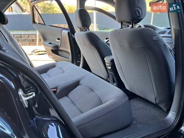 Черный Рено Лагуна, объемом двигателя 1.6 л и пробегом 99 тыс. км за 5300 $, фото 24 на Automoto.ua