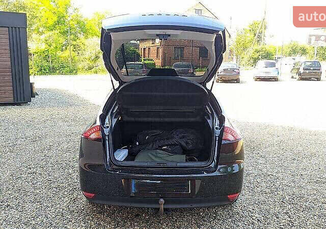 Черный Рено Лагуна, объемом двигателя 1.5 л и пробегом 307 тыс. км за 6300 $, фото 1 на Automoto.ua