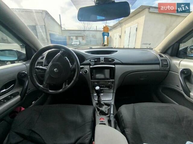 Рено Лагуна 2004 в Волочиске на Automoto.ua Синий Рено Лагуна, объемом двигателя 1.9 л и пробегом 281 тыс. км за 3200 $, фото 10 на Automoto.ua