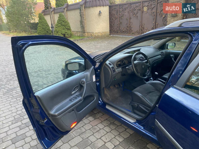 Синий Рено Лагуна, объемом двигателя 2 л и пробегом 240 тыс. км за 4800 $, фото 4 на Automoto.ua