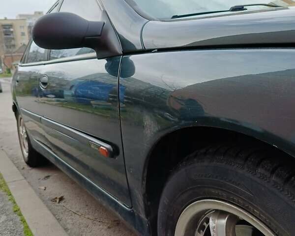 Зеленый Рено Лагуна, объемом двигателя 2 л и пробегом 320 тыс. км за 1999 $, фото 6 на Automoto.ua