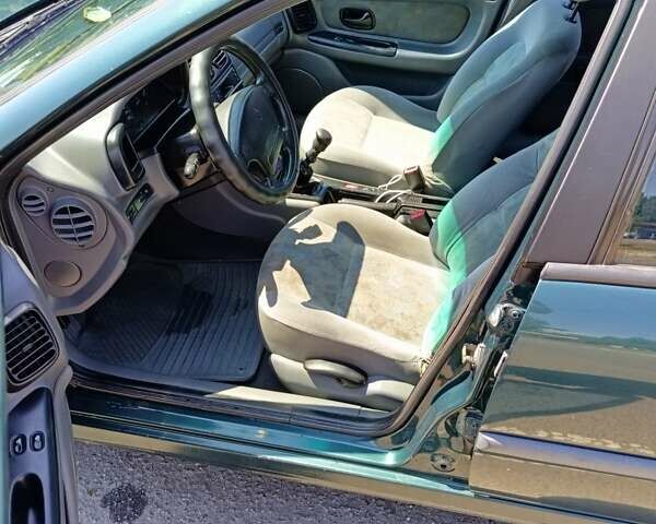 Зеленый Рено Лагуна, объемом двигателя 2 л и пробегом 325 тыс. км за 2400 $, фото 6 на Automoto.ua