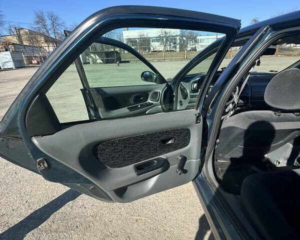 Зелений Рено Лагуна, об'ємом двигуна 1.8 л та пробігом 225 тис. км за 2450 $, фото 11 на Automoto.ua