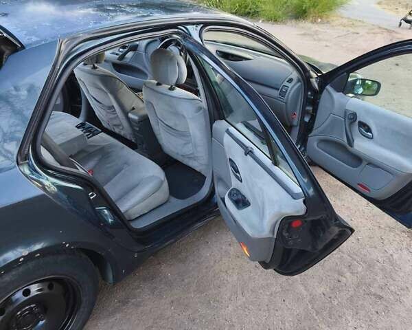 Зеленый Рено Лагуна, объемом двигателя 1.8 л и пробегом 359 тыс. км за 1650 $, фото 6 на Automoto.ua