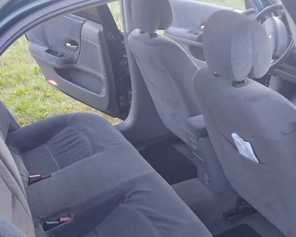 Зеленый Рено Лагуна, объемом двигателя 1.8 л и пробегом 260 тыс. км за 3200 $, фото 3 на Automoto.ua
