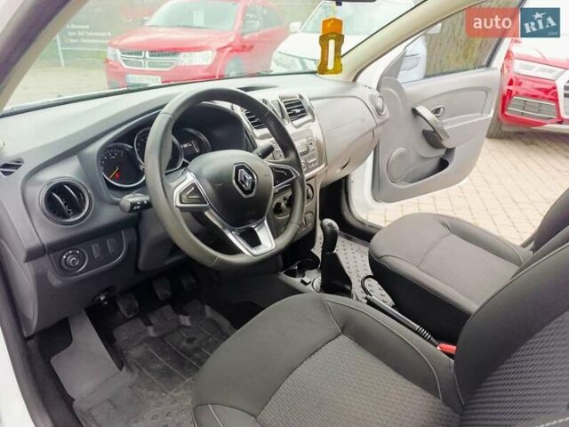 Белый Рено Логан, объемом двигателя 1 л и пробегом 130 тыс. км за 5750 $, фото 8 на Automoto.ua