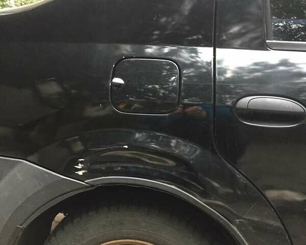 Черный Рено Логан, объемом двигателя 1.39 л и пробегом 224 тыс. км за 2600 $, фото 8 на Automoto.ua