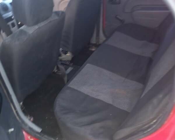 Красный Рено Логан, объемом двигателя 1.4 л и пробегом 246 тыс. км за 2450 $, фото 1 на Automoto.ua