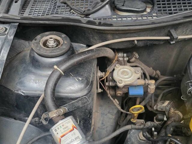 Серый Рено Логан, объемом двигателя 1.4 л и пробегом 211 тыс. км за 2499 $, фото 6 на Automoto.ua