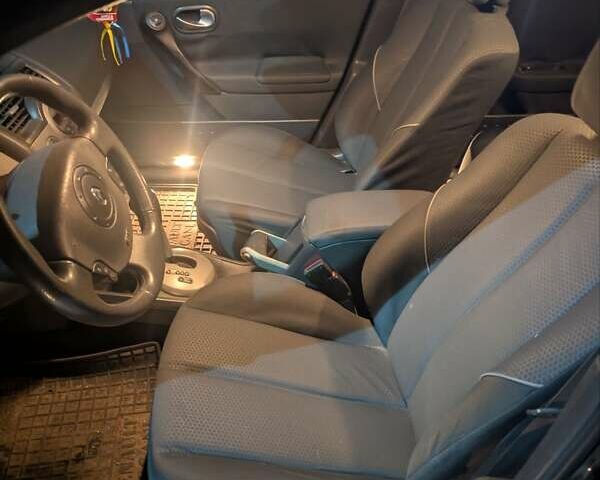 Чорний Рено Меган, об'ємом двигуна 2 л та пробігом 236 тис. км за 4300 $, фото 2 на Automoto.ua
