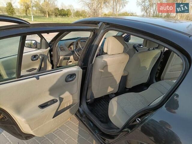 Черный Рено Меган, объемом двигателя 1.6 л и пробегом 210 тыс. км за 4300 $, фото 7 на Automoto.ua