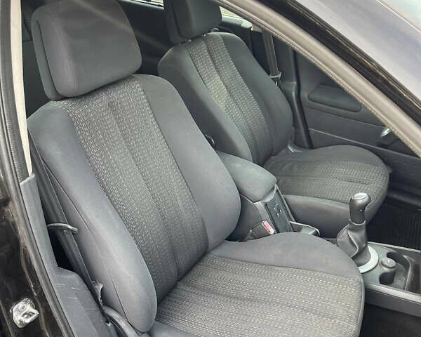 Черный Рено Меган, объемом двигателя 1.6 л и пробегом 235 тыс. км за 4200 $, фото 14 на Automoto.ua