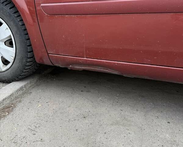 Красный Рено Меган, объемом двигателя 1.39 л и пробегом 200 тыс. км за 4000 $, фото 10 на Automoto.ua