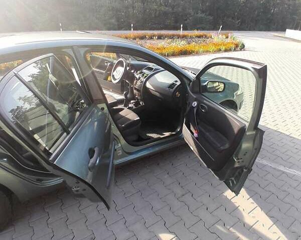 Зеленый Рено Меган, объемом двигателя 1.6 л и пробегом 281 тыс. км за 5200 $, фото 4 на Automoto.ua