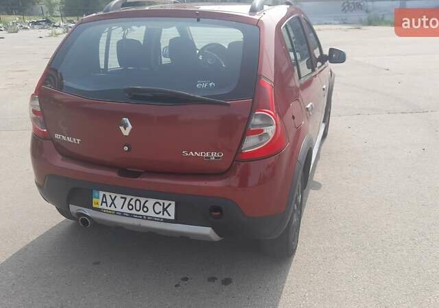 Красный Рено Сандеро, объемом двигателя 1.6 л и пробегом 185 тыс. км за 6200 $, фото 1 на Automoto.ua